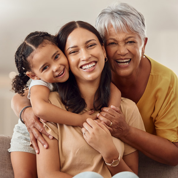 three generations of woman smiling together